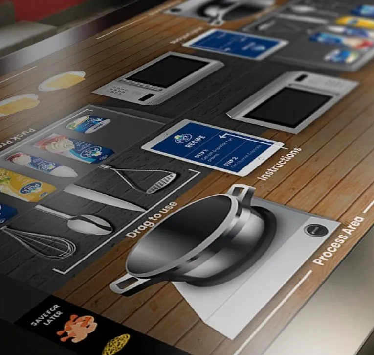 Puck multiplayer cooking game on an 80 inch touch table